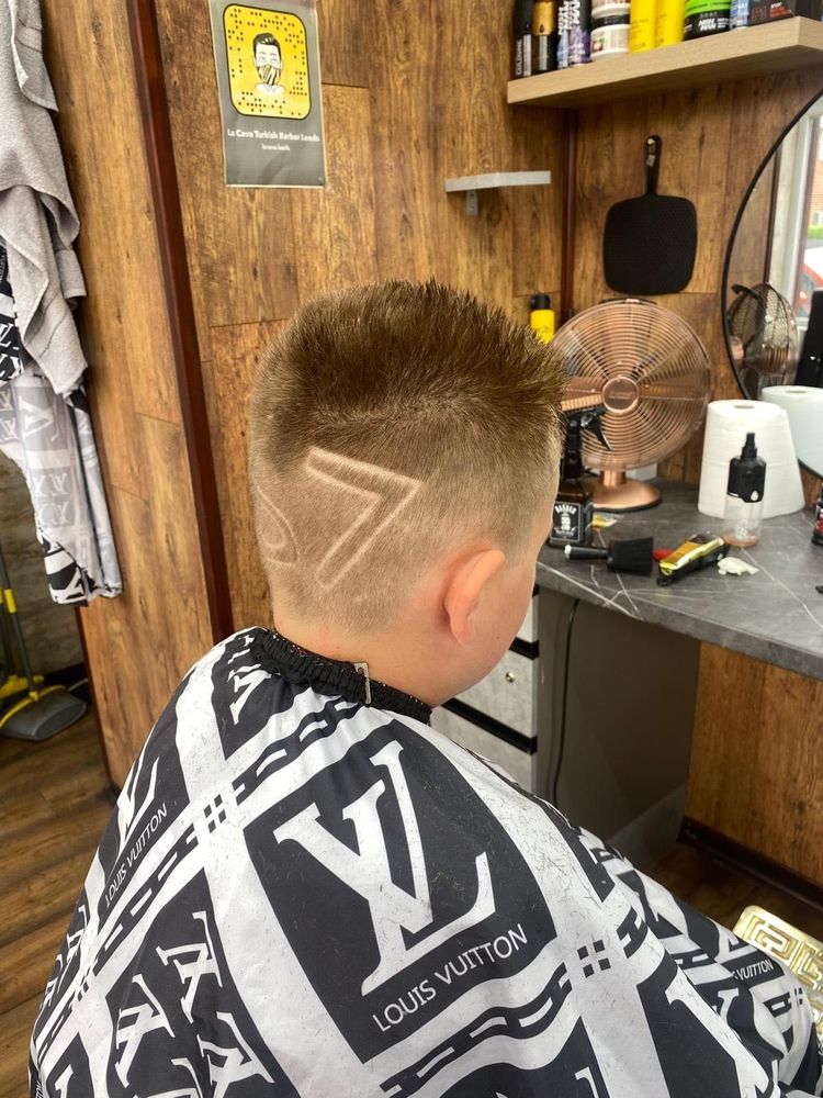 A young customer with a shaved 7 pattern